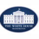 The image shows the official logo of the White House, often seen at events like the Made in America Roundtable. It features a white illustration of the White House on a dark blue oval background, with "THE WHITE HOUSE WASHINGTON" below in capitals.