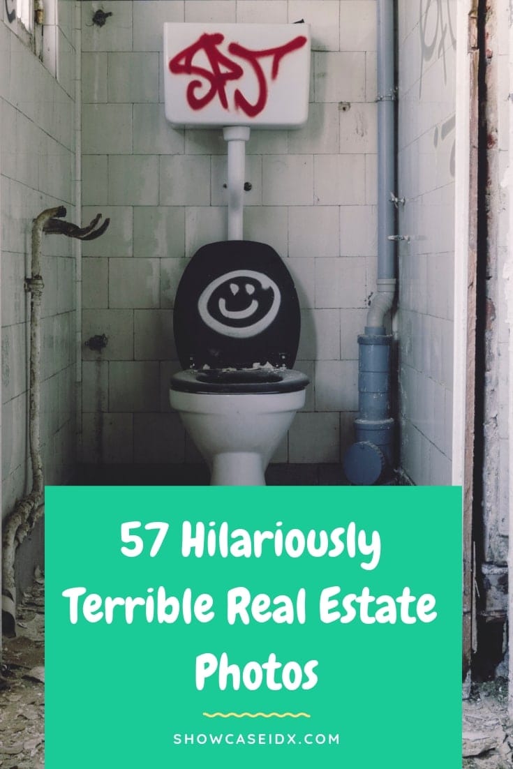 A dirty, run-down bathroom with peeling tiles and pipes exposed. The toilet has a black seat with a white smiling face painted on it, and the tank has red graffiti. A green banner reads, “57 Hilariously Terrible Real Estate Photos.”.